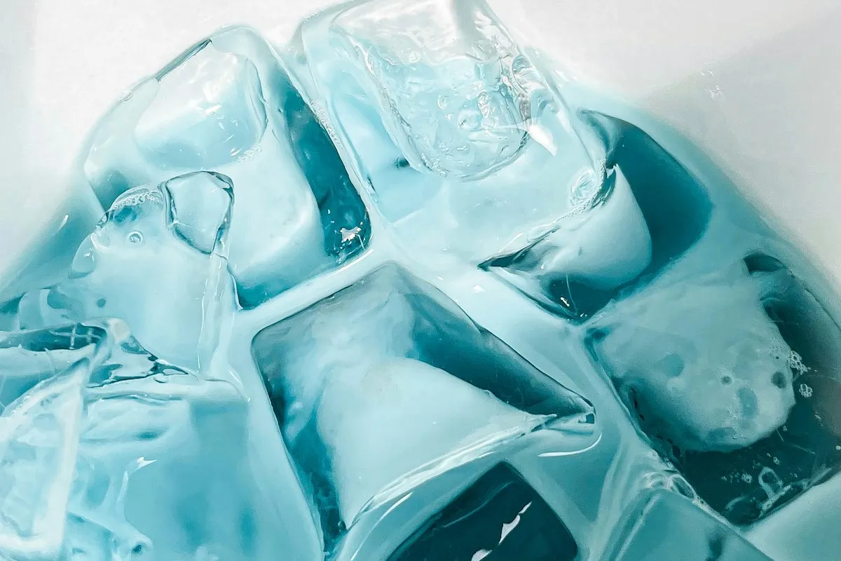 Close-up of ice cubes with a blue tint