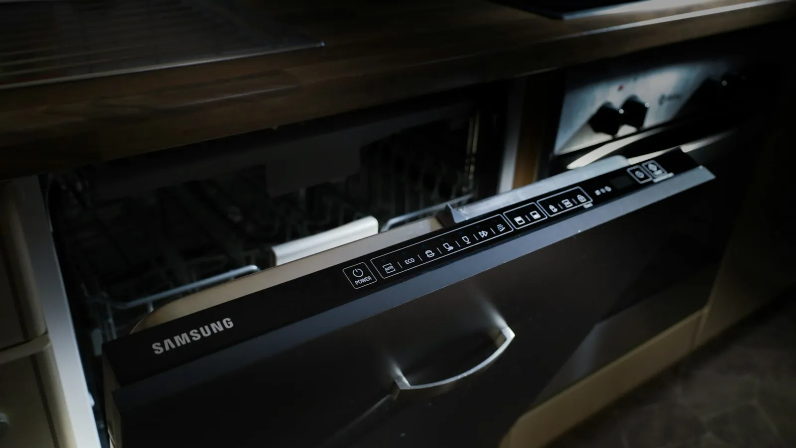 Control panel on the top edge of a built-in Samsung dishwasher