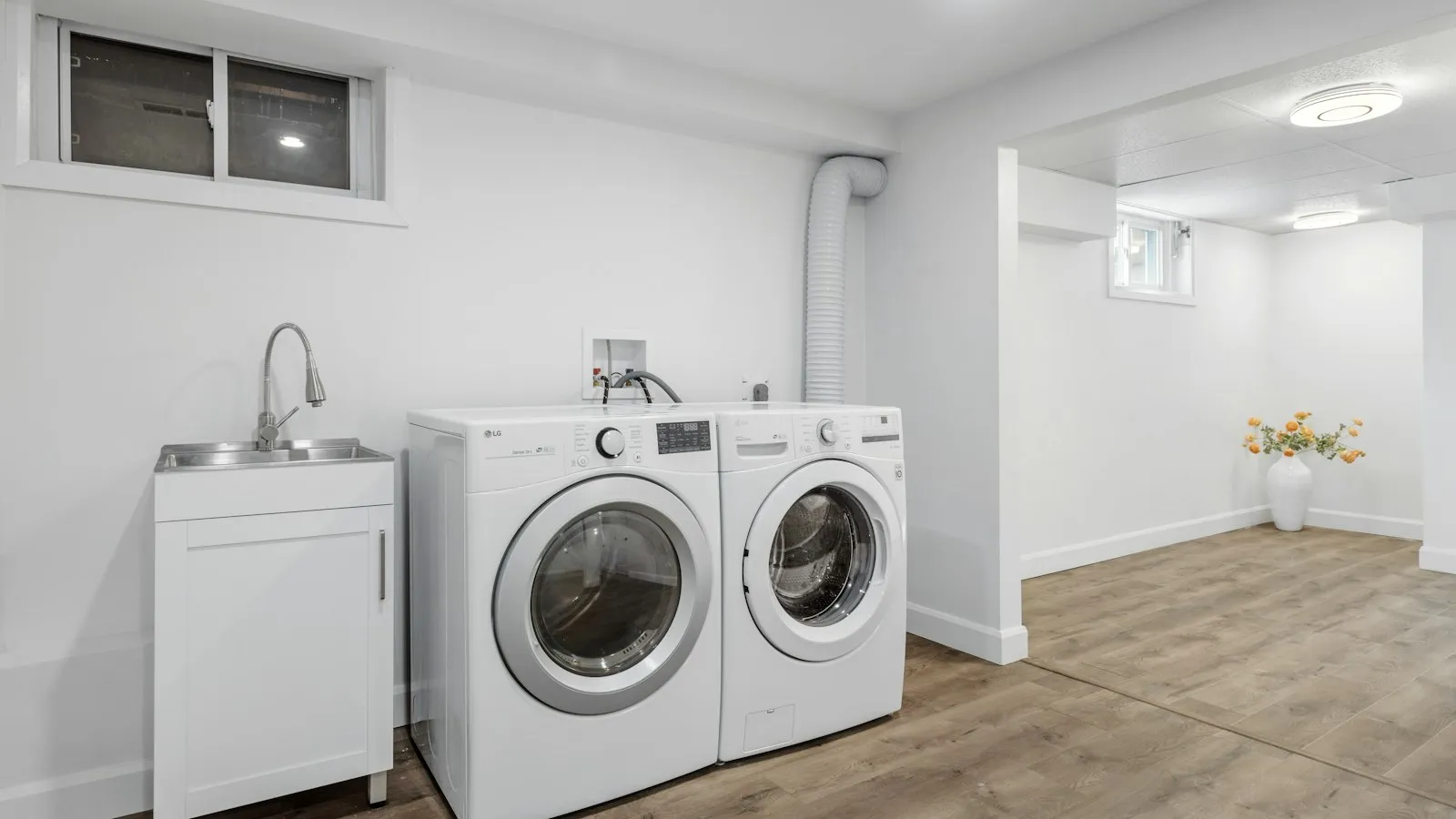 A laundry room with a washer and dryer