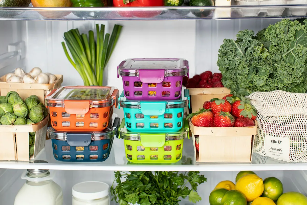Food containers stacked inside a refrigerator