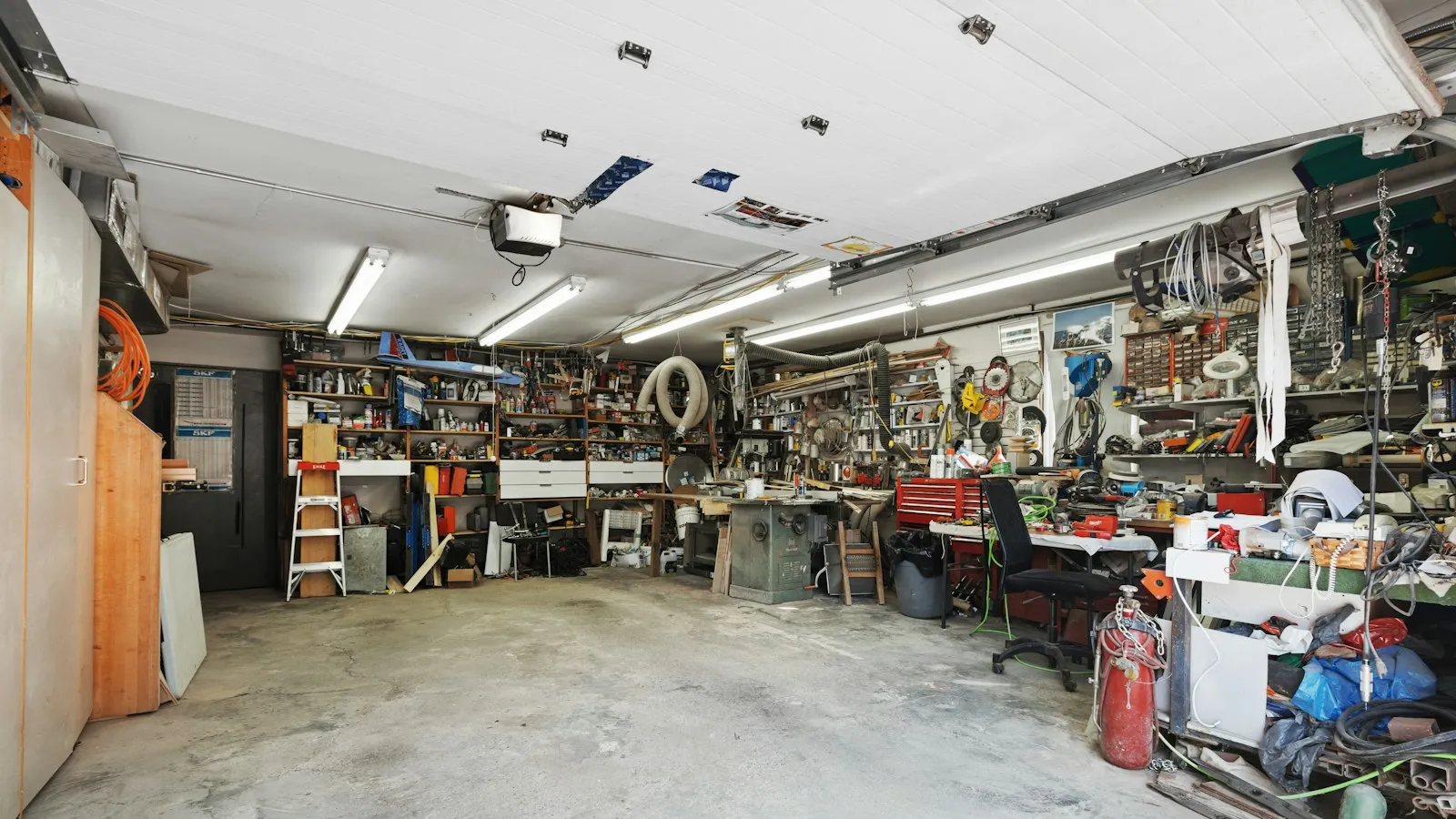 Home garage with a workbench, tools and shelves
