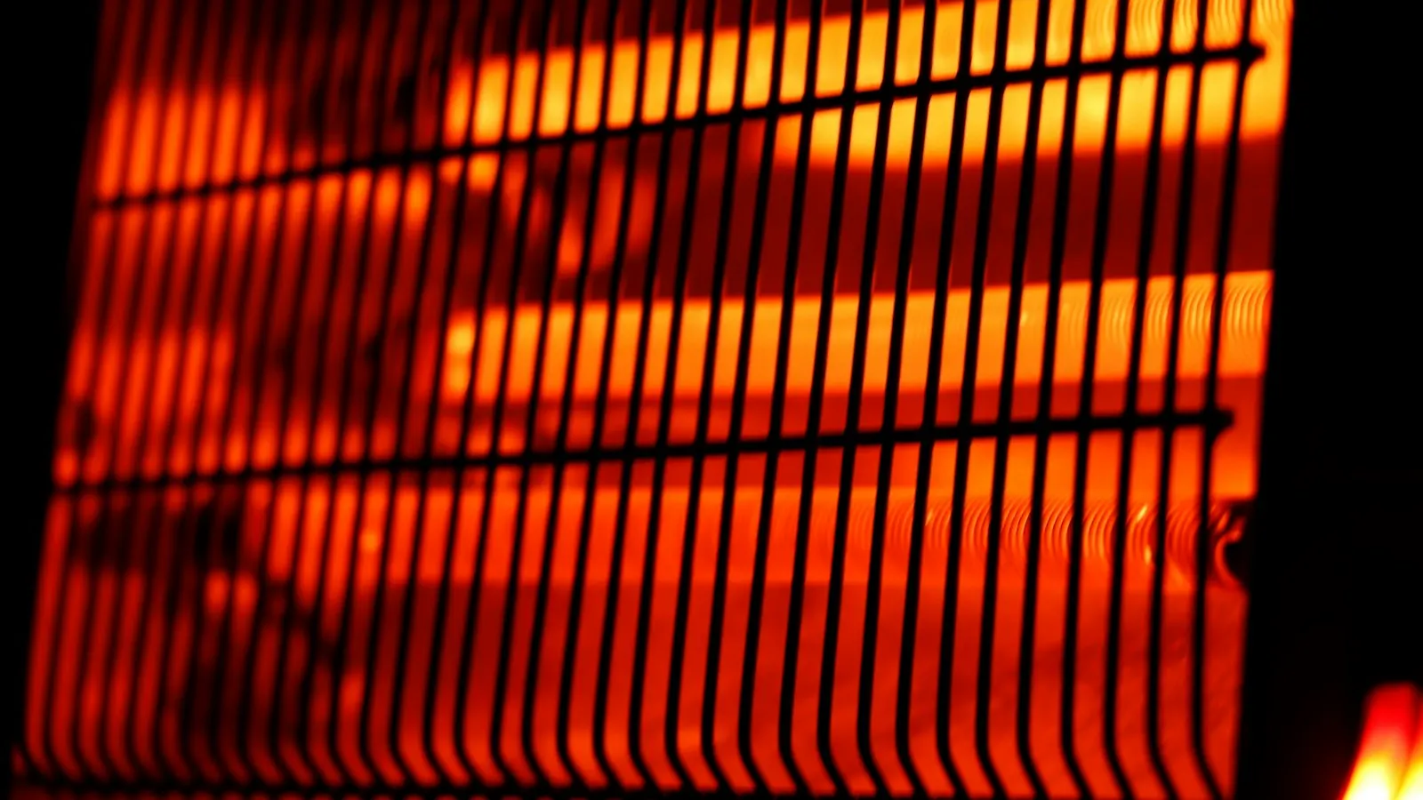The glowing orange bars of an electric radiant heater