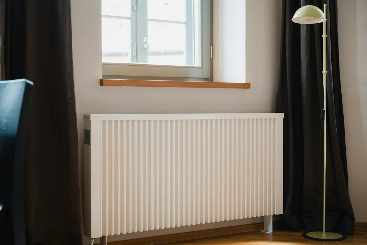 A white panel radiator under a window