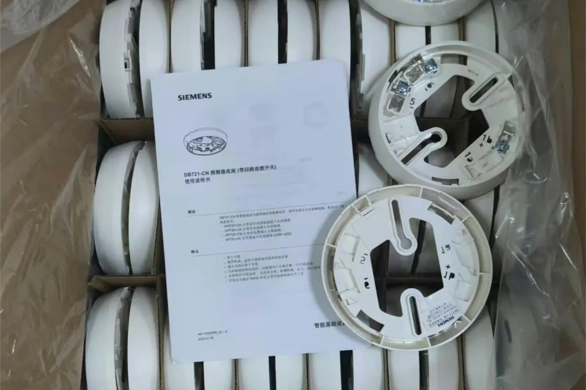 A box of new white smoke detectors