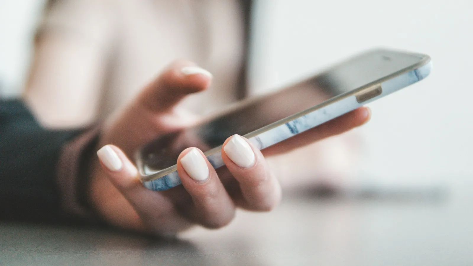 Hand holding a smartphone